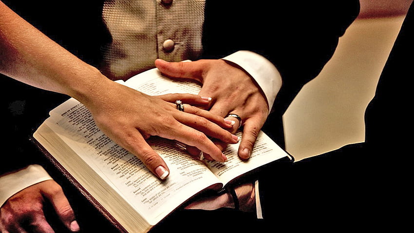 desktop-wallpaper-wearing-weddng-rings-on-to-pf-open-bible